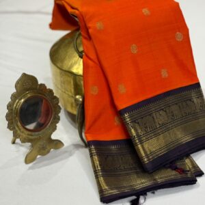 Pure Kanchipuram Silk Saree In Bright Orange With Dual Tone Of Coffee Brown And Deep Plum